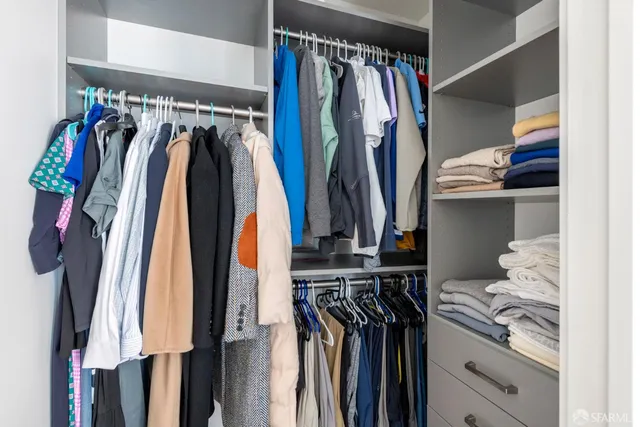 a roof deck with a table and chairs