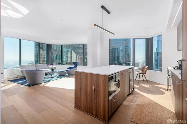 a living room with granite countertop furniture and a sink