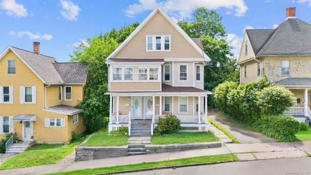 a front view of a house with a yard