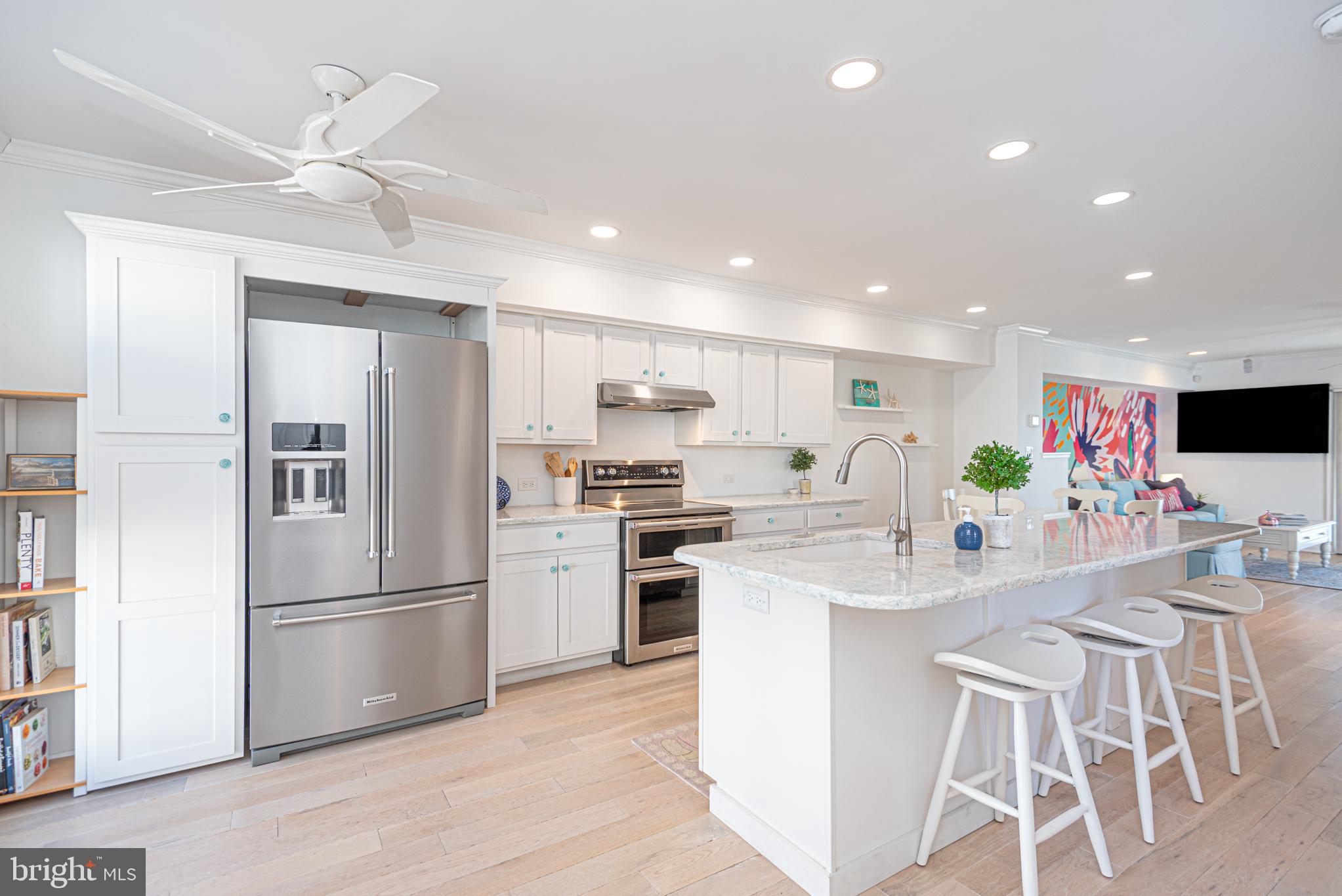 37845 Salt Grass Cove, Unit 89 Ocean View, DE 19970 - Photo 11 of 83 a kitchen with appliances a sink and a refrigerator