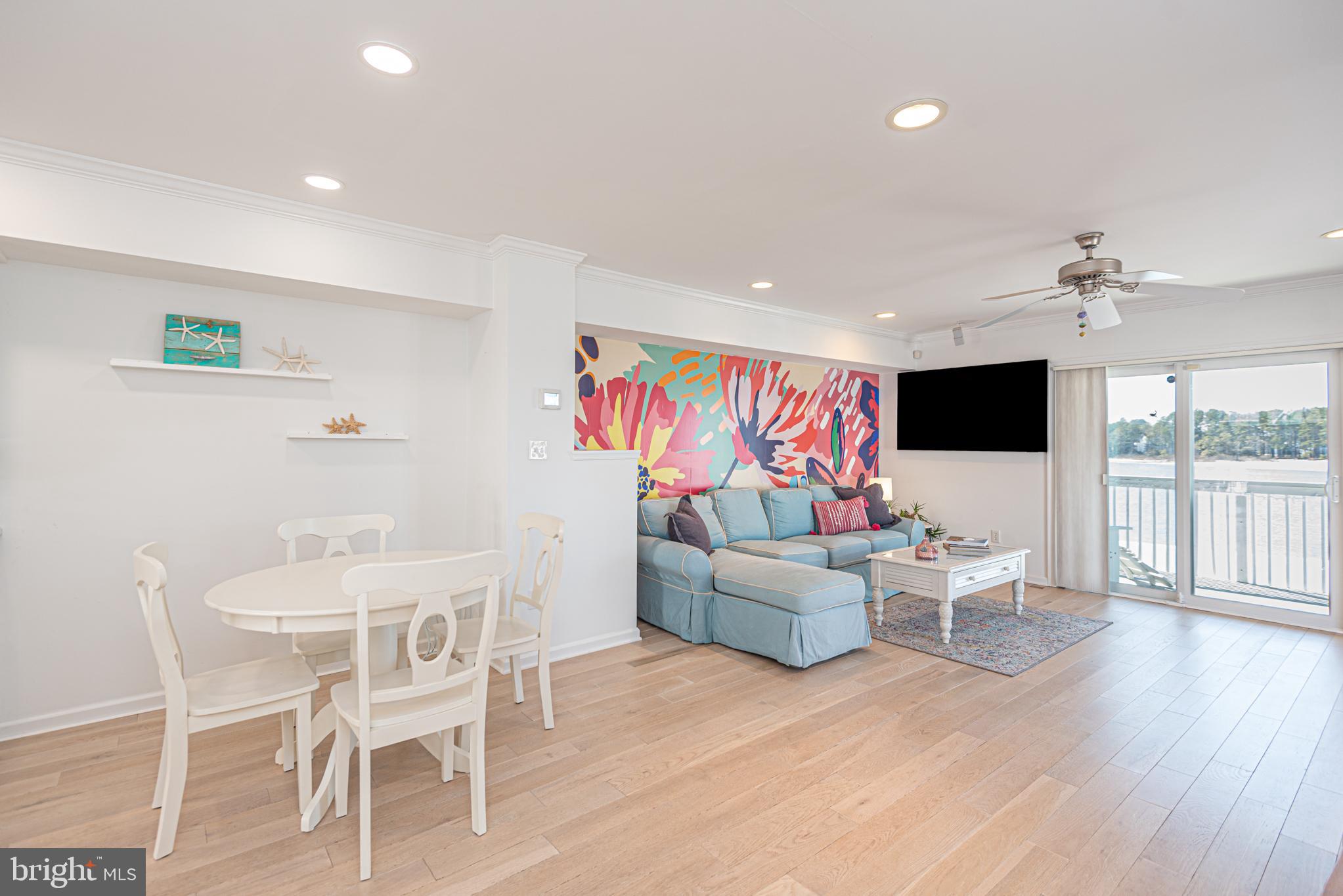 37845 Salt Grass Cove, Unit 89 Ocean View, DE 19970 - Photo 23 of 83 a living room with fireplace furniture and a flat screen tv