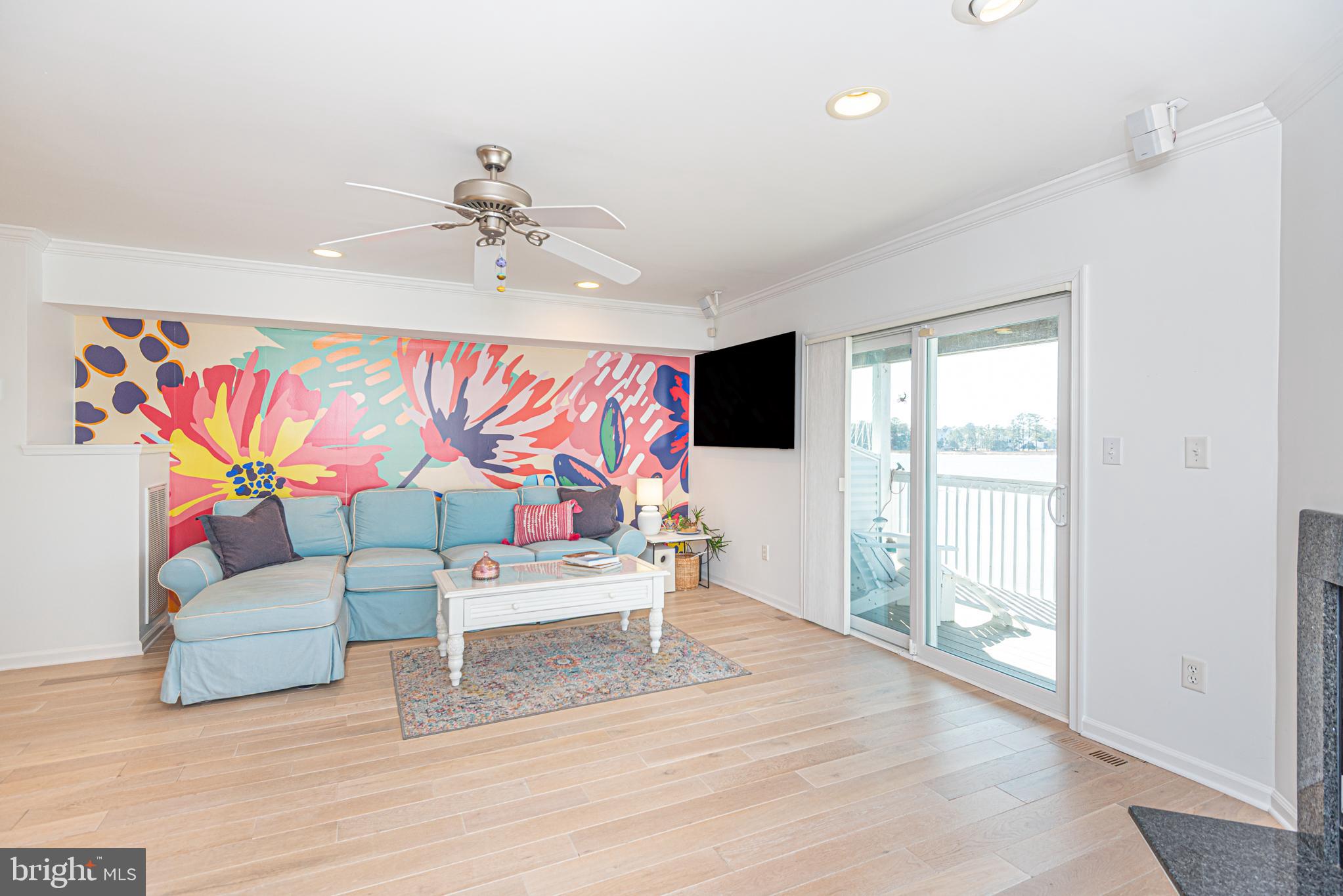 37845 Salt Grass Cove, Unit 89 Ocean View, DE 19970 - Photo 25 of 83 a living room with furniture and a flat screen tv