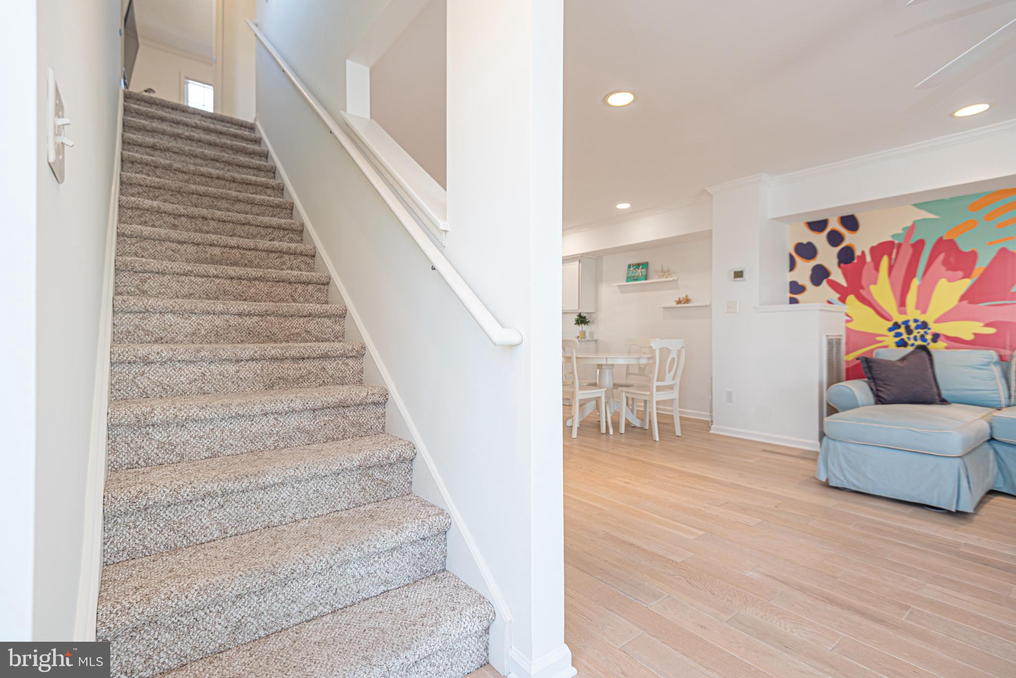 37845 Salt Grass Cove, Unit 89 Ocean View, DE 19970 - Photo 32 of 83 a view of entryway and hall with wooden floor