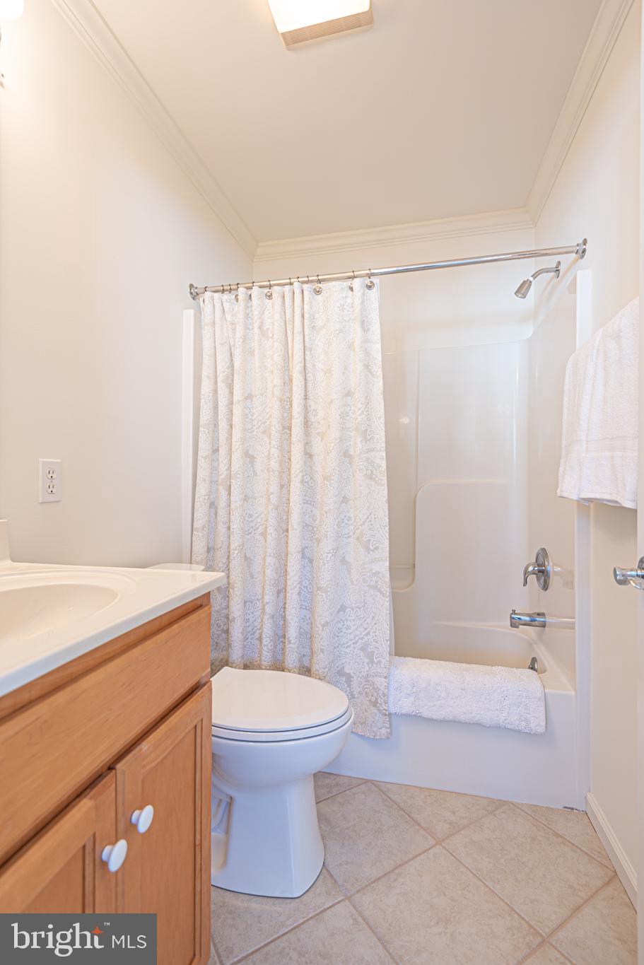 37845 Salt Grass Cove, Unit 89 Ocean View, DE 19970 - Photo 38 of 83 a bathroom with a sink a toilet and shower