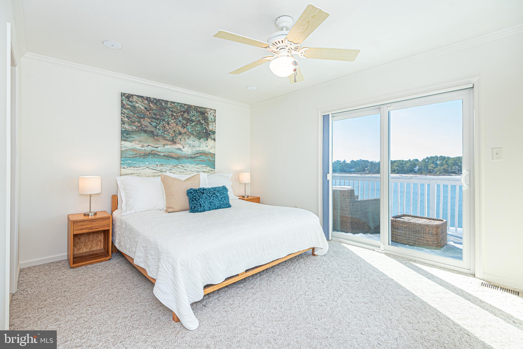 37845 Salt Grass Cove, Unit 89 Ocean View, DE 19970 - Photo 43 of 83 a bedroom with a bed and a large window