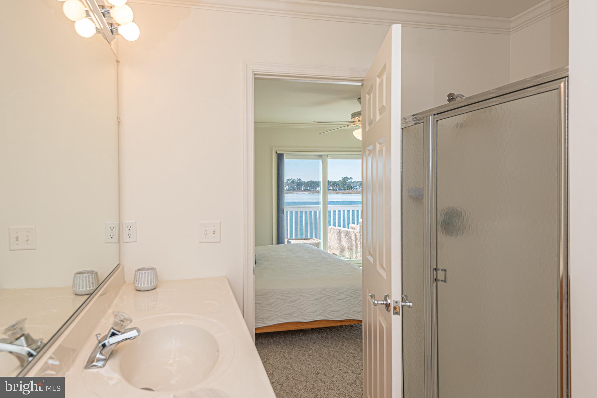 37845 Salt Grass Cove, Unit 89 Ocean View, DE 19970 - Photo 53 of 83 a bathroom with a tub sink vanity and toilet
