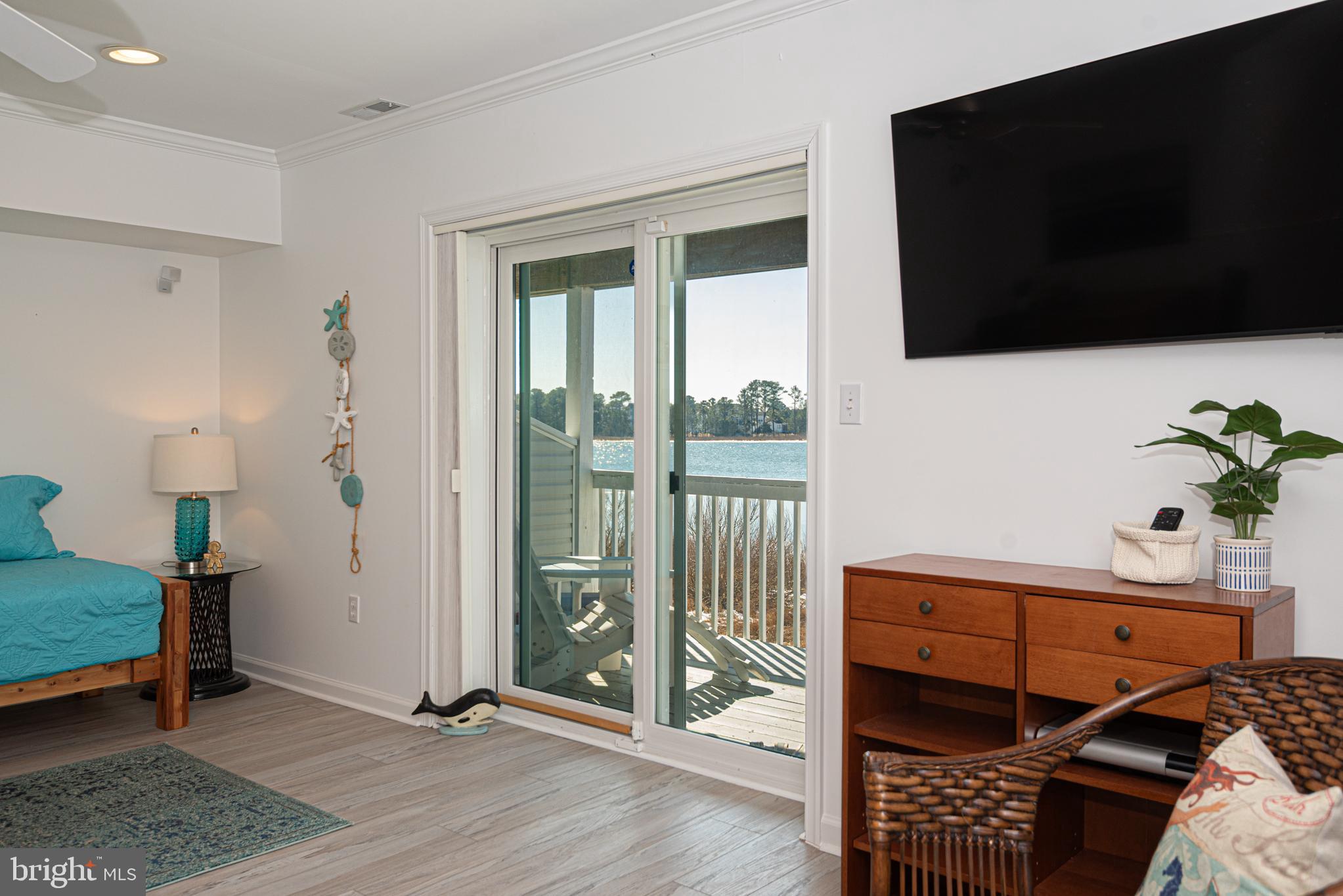 37845 Salt Grass Cove, Unit 89 Ocean View, DE 19970 - Photo 60 of 83 a bedroom with furniture and a flat screen tv