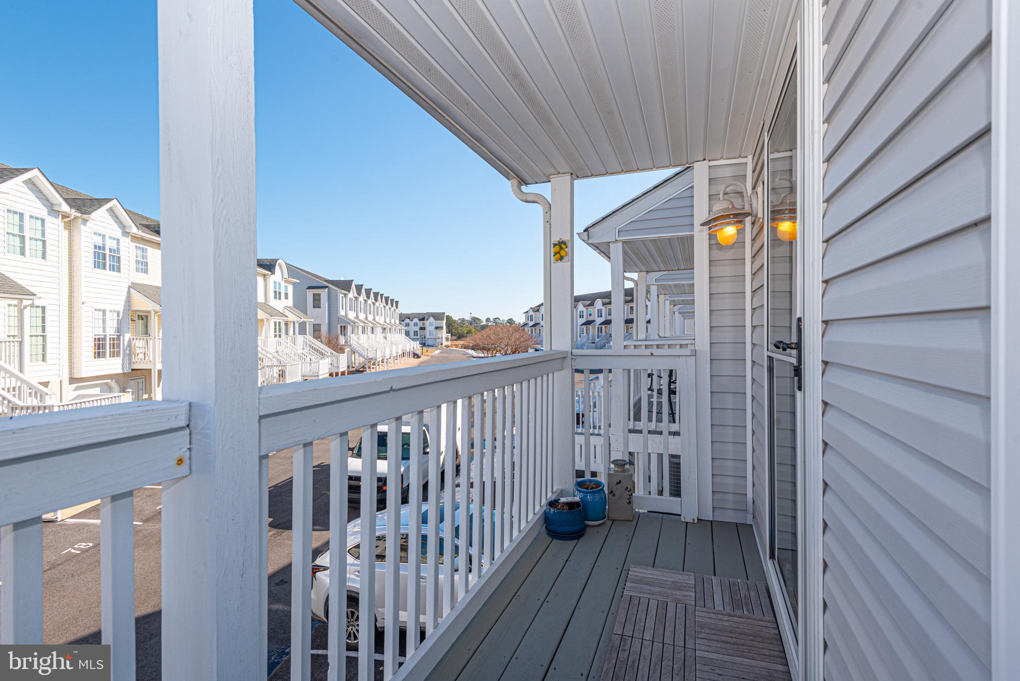37845 Salt Grass Cove, Unit 89 Ocean View, DE 19970 - Photo 7 of 83 a view of a balcony with wooden floor
