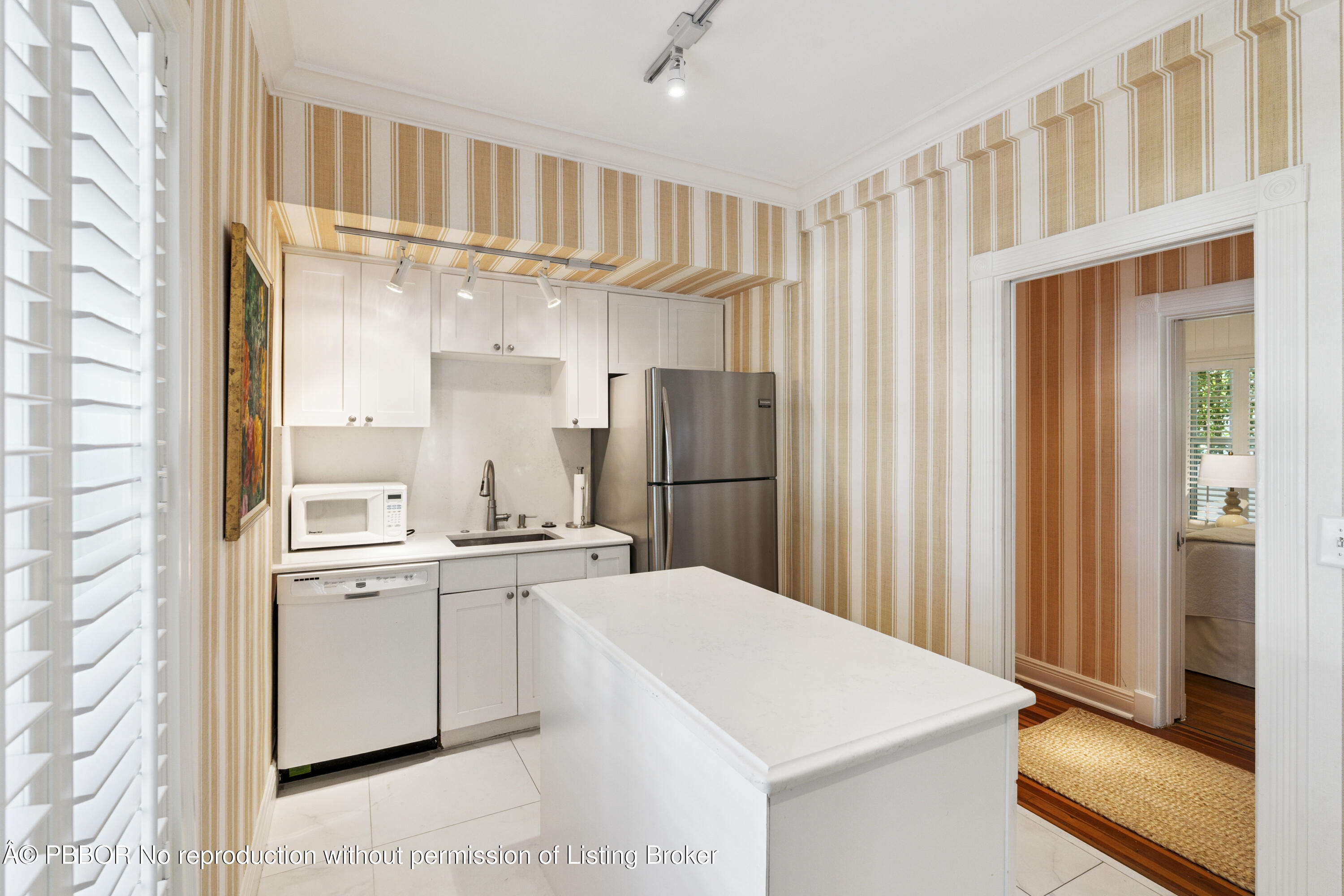 151 South County Road, Unit 1 Palm Beach, FL 33480 - Photo 11 of 21 a kitchen with a sink a refrigerator and cabinets