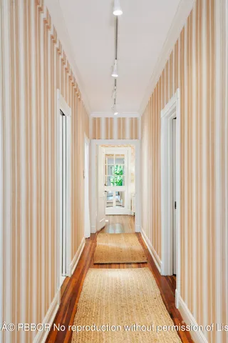 a view of a hallway with windows