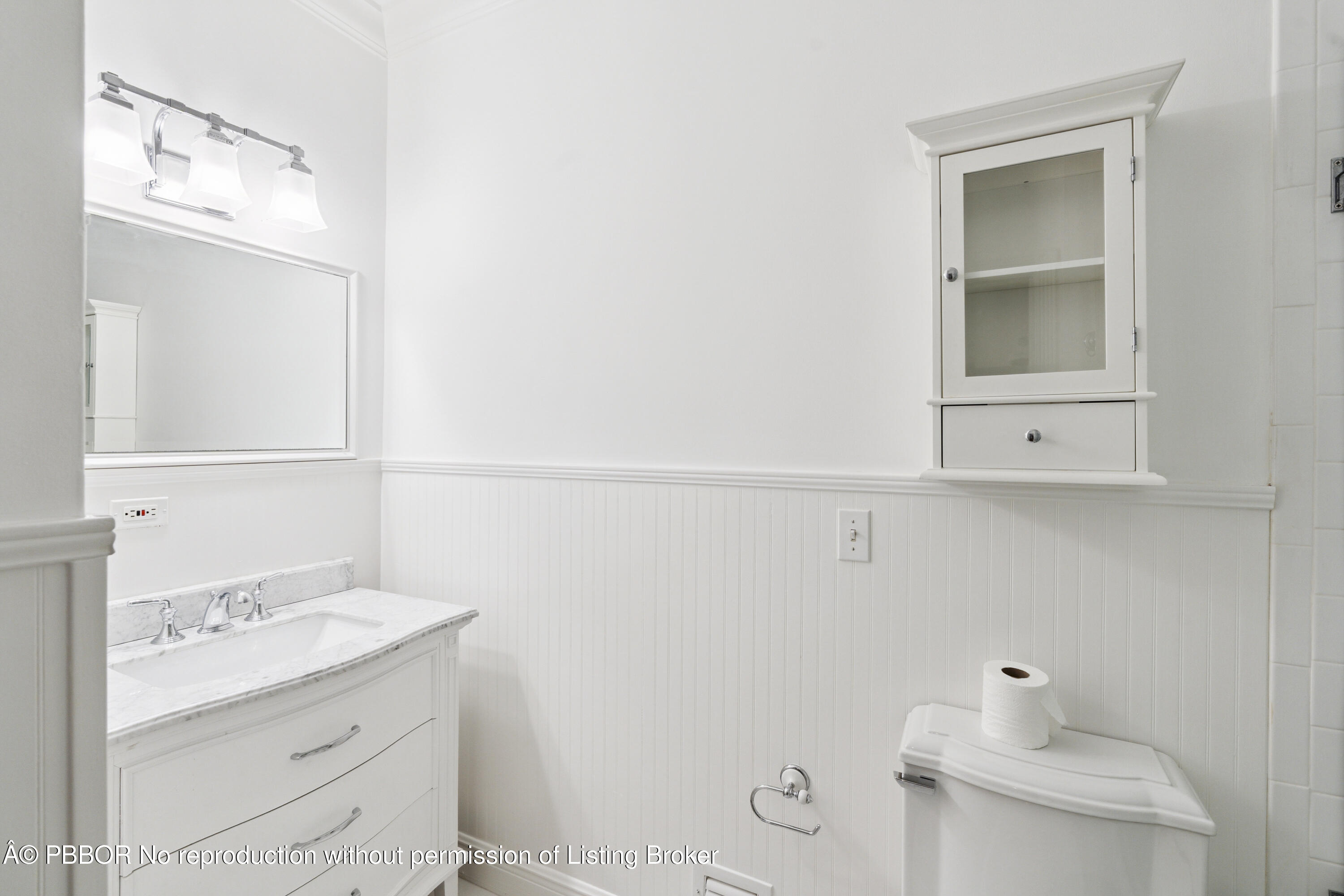 151 South County Road, Unit 1 Palm Beach, FL 33480 - Photo 15 of 21 a bathroom with a sink a toilet and mirror