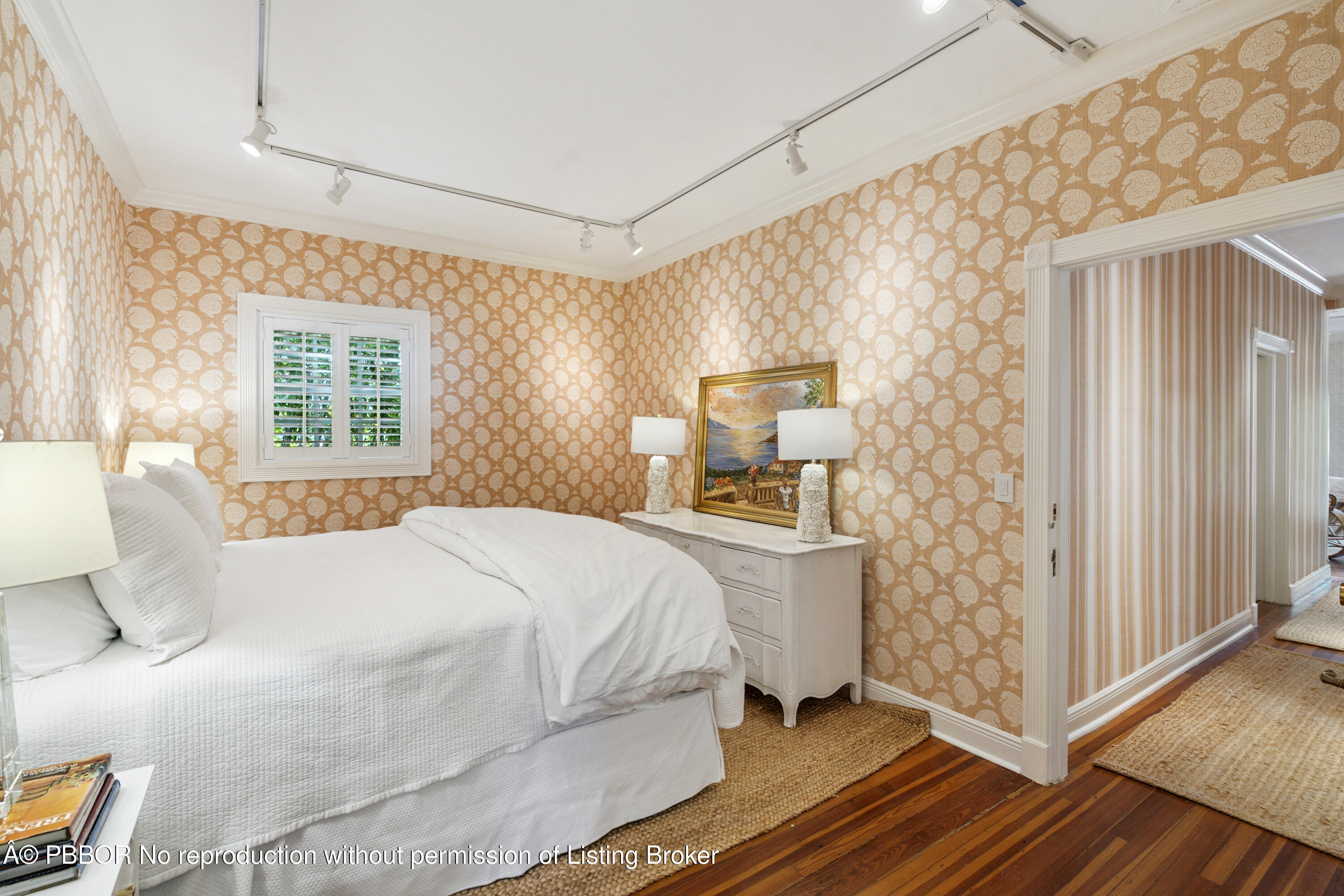 151 South County Road, Unit 1 Palm Beach, FL 33480 - Photo 16 of 21 a bedroom with a bed and wooden floor