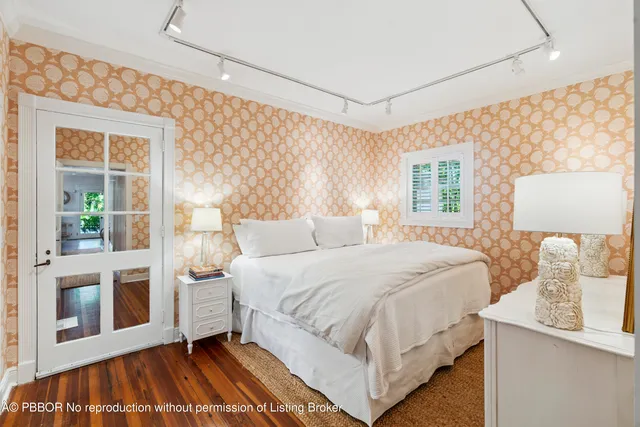 a bedroom with a large bed and a window