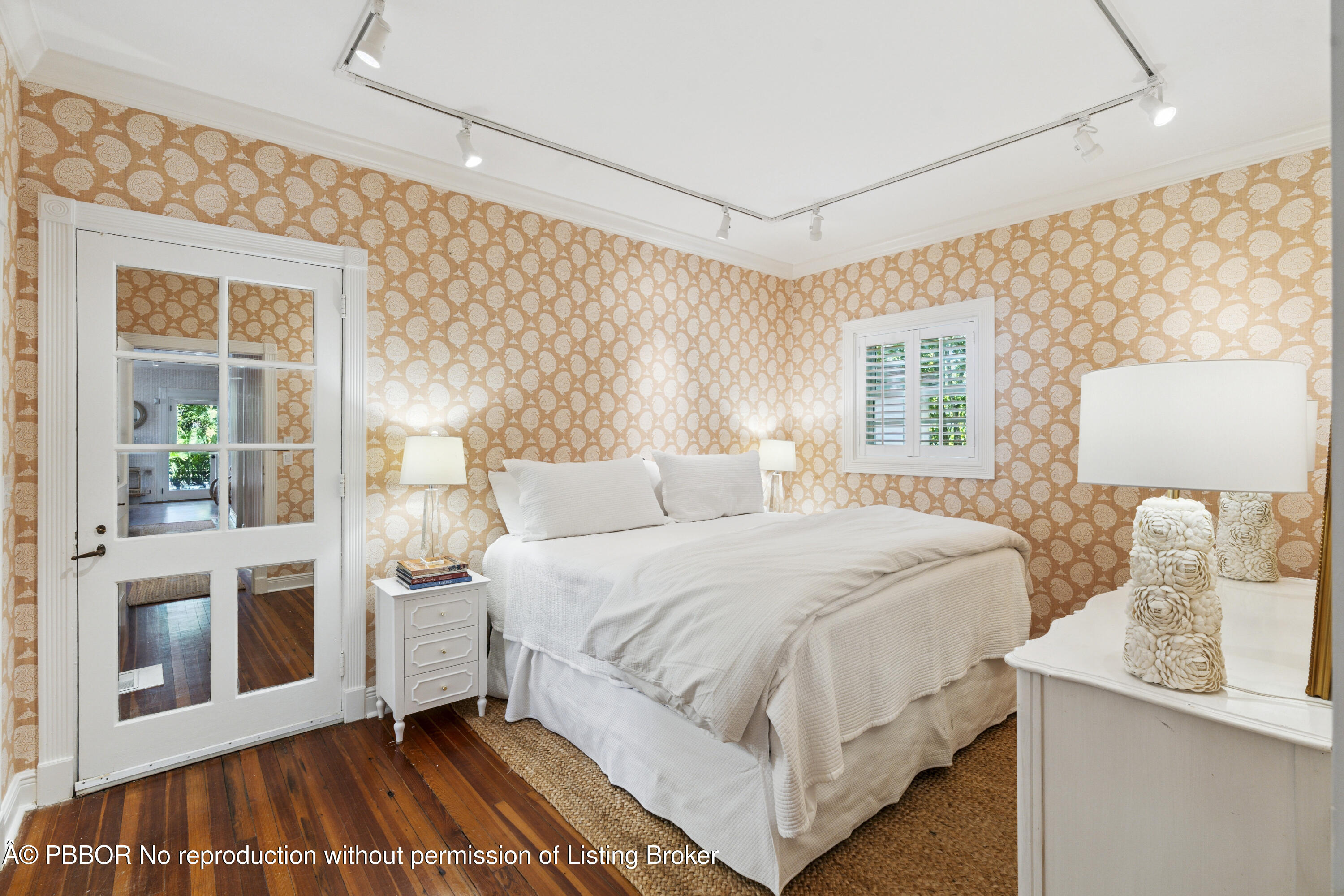 151 South County Road, Unit 1 Palm Beach, FL 33480 - Photo 17 of 21 a bedroom with a large bed and a window