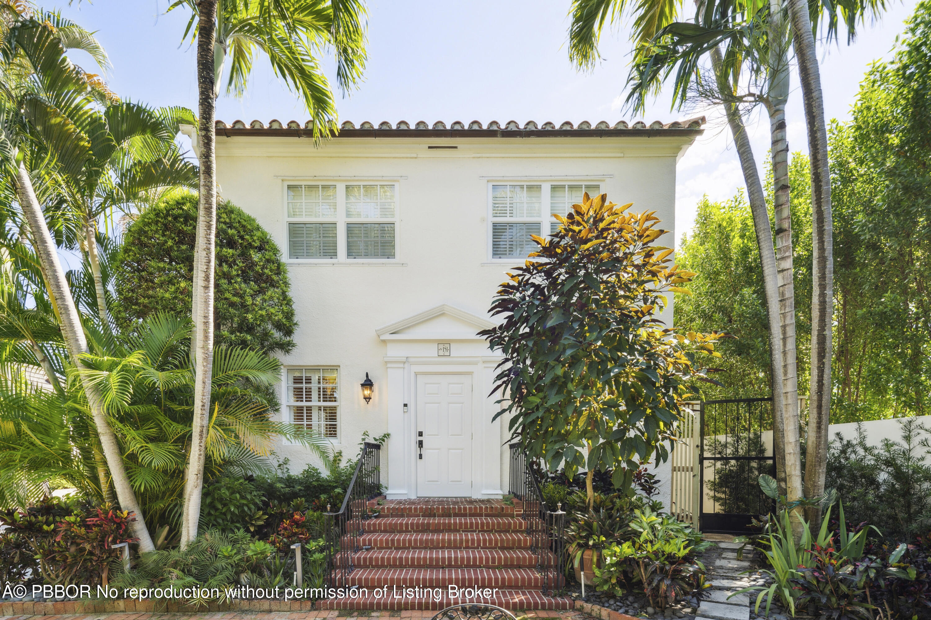 151 South County Road, Unit 1 Palm Beach, FL 33480 - Photo 2 of 21 a front view of a house with garden
