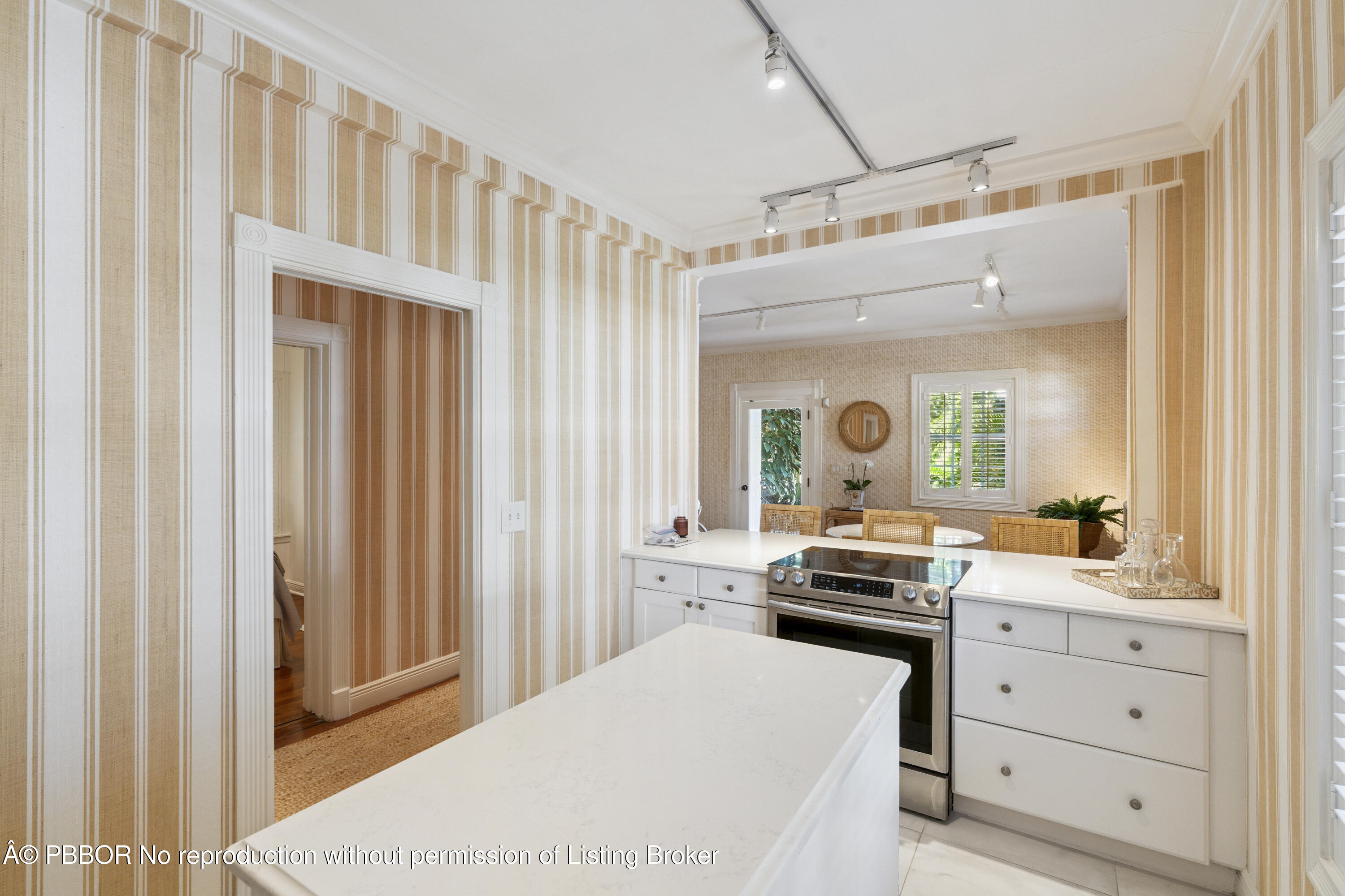 151 South County Road, Unit 1 Palm Beach, FL 33480 - Photo 10 of 21 a kitchen with a refrigerator and white cabinets