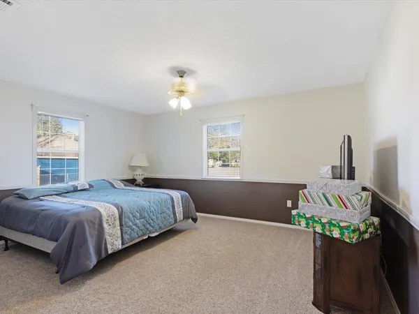 a bedroom with a bed and window