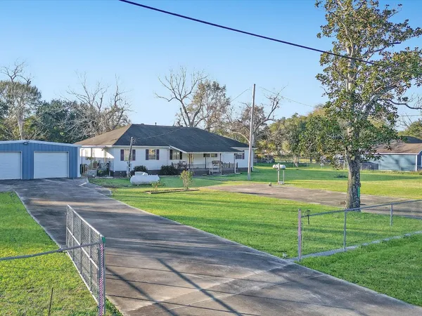 a view of a house with a big yard