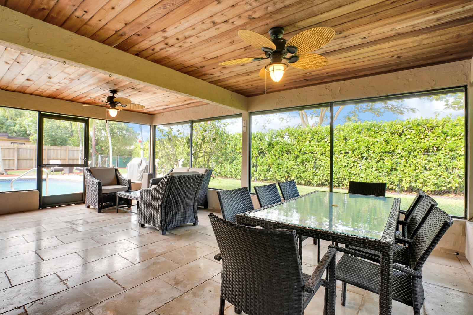 979 Southwest 18th Street Boca Raton, FL 33486 - Photo 25 of 30 a dining room with furniture large windows and a chandelier