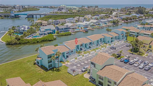 an aerial view of a house with a lake view