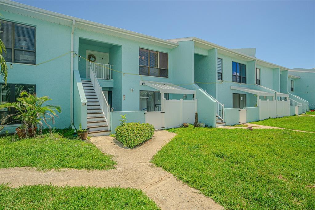 1 Windrush Boulevard, Unit 54 Indian Rocks Beach, FL 33785 - Photo 12 of 37 a view of outdoor space yard and deck