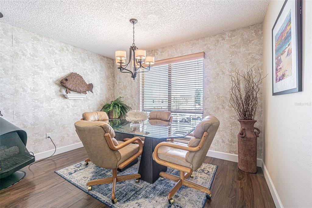 1 Windrush Boulevard, Unit 54 Indian Rocks Beach, FL 33785 - Photo 14 of 37 a view of a livingroom with furniture window and wooden floor