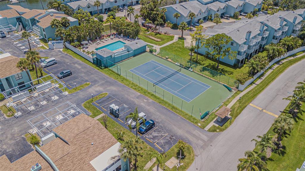 1 Windrush Boulevard, Unit 54 Indian Rocks Beach, FL 33785 - Photo 32 of 37 an aerial view of a house with a yard