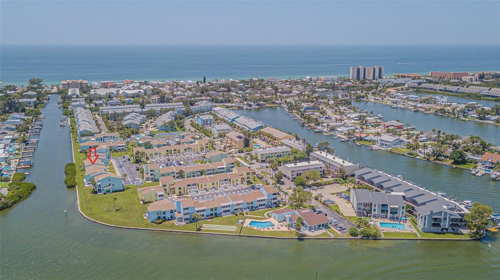 1 Windrush Boulevard, Unit 54 Indian Rocks Beach, FL 33785 - Photo 33 of 37 an aerial view of residential houses with outdoor space