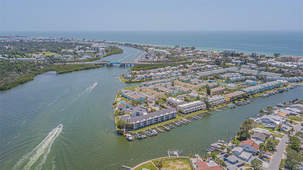 1 Windrush Boulevard, Unit 54 Indian Rocks Beach, FL 33785 - Photo 35 of 37 an aerial view of a house with a lake view