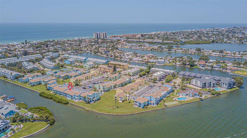1 Windrush Boulevard, Unit 54 Indian Rocks Beach, FL 33785 - Photo 36 of 37 an aerial view of residential houses with outdoor space