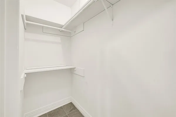 a view of an empty walk in closet