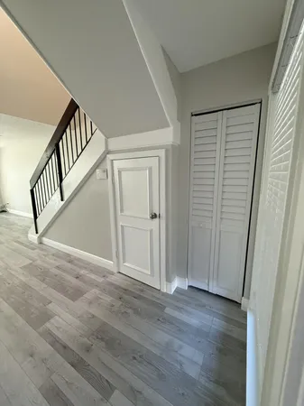 a view of entryway with wooden floor