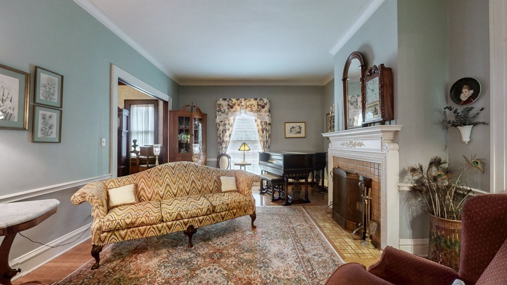 505 Walnut Street Paris, TN 38242 - Photo 18 of 54 a living room with furniture a fireplace and a large mirror