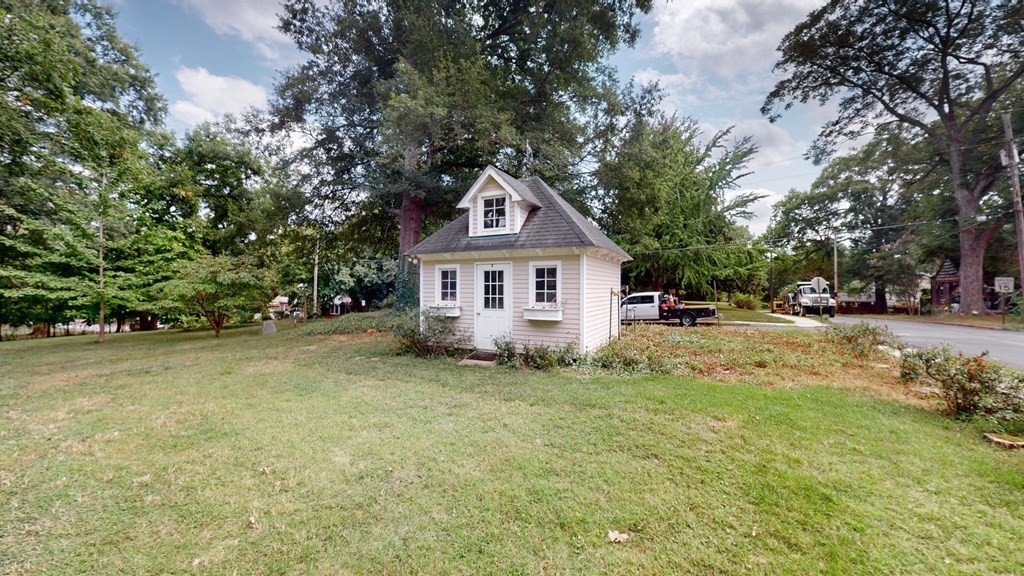505 Walnut Street Paris, TN 38242 - Photo 22 of 54 a front view of a house with a garden