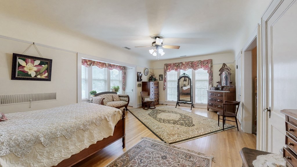 505 Walnut Street Paris, TN 38242 - Photo 24 of 54 a bedroom with a bed mirror and window