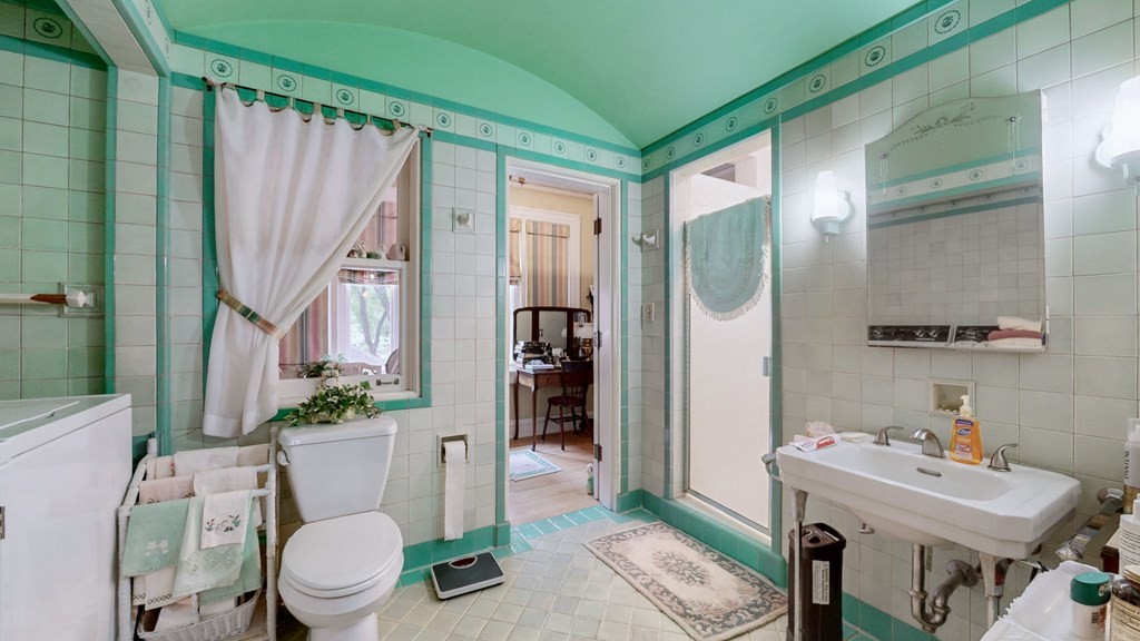 505 Walnut Street Paris, TN 38242 - Photo 25 of 54 a bathroom with a sink toilet and shower