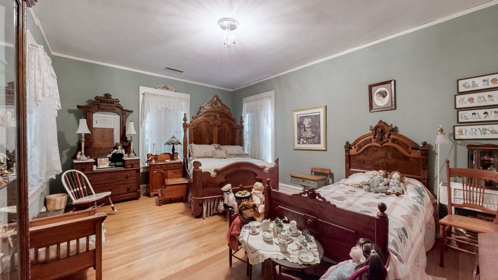 505 Walnut Street Paris, TN 38242 - Photo 28 of 54 a bedroom with furniture and wooden floor