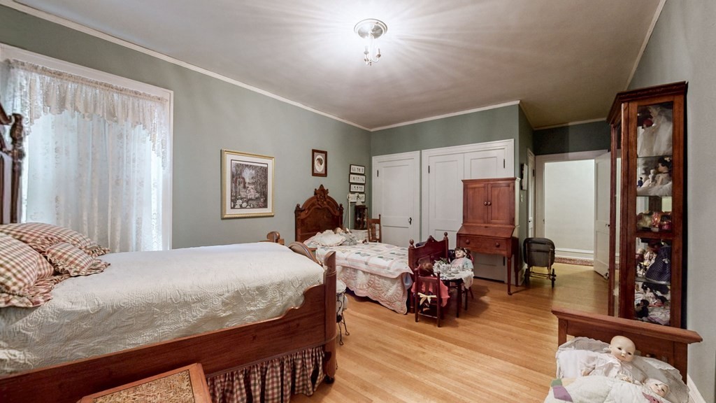 505 Walnut Street Paris, TN 38242 - Photo 29 of 54 a bedroom with a bed and wooden floor