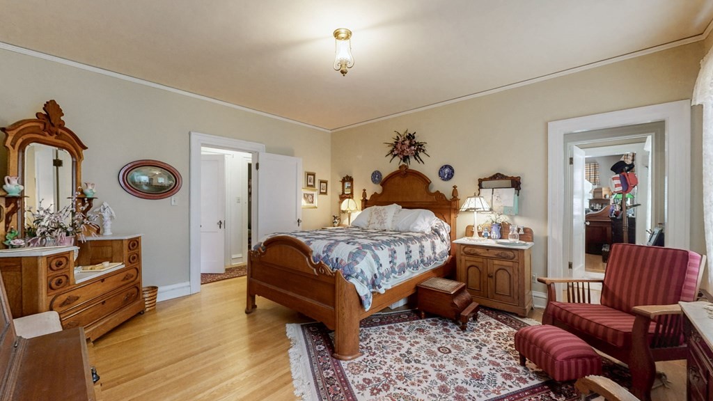 505 Walnut Street Paris, TN 38242 - Photo 30 of 54 a bedroom with a bed and wooden floor