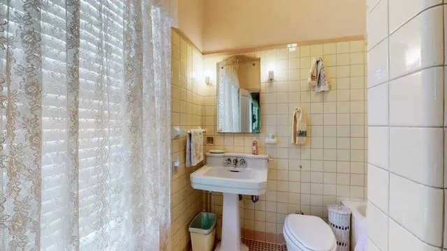 a bathroom with a bathtub and shower