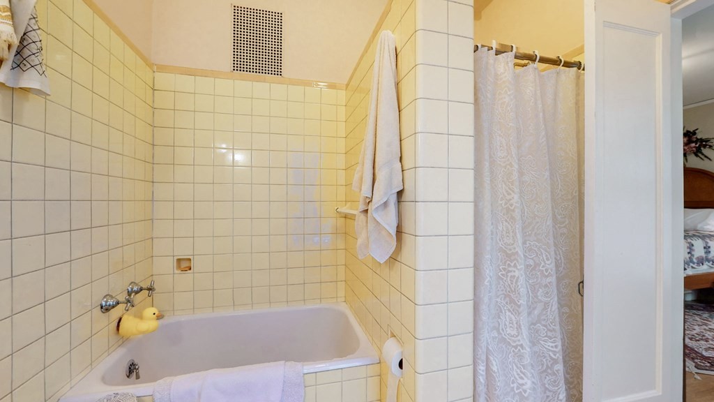 505 Walnut Street Paris, TN 38242 - Photo 32 of 54 a bathroom with a bathtub and a shower