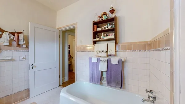 a bedroom with furniture and a wooden floor