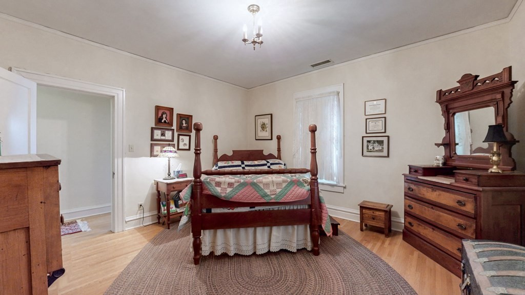 505 Walnut Street Paris, TN 38242 - Photo 37 of 54 a bedroom with furniture and a wooden floor