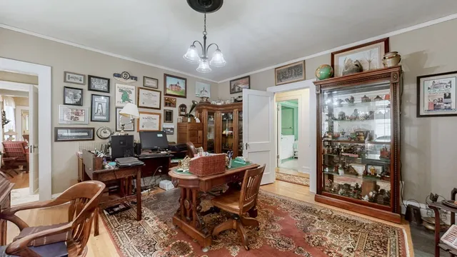 a view of a livingroom with furniture and a flat screen tv