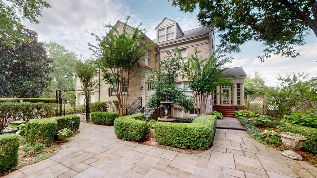 505 Walnut Street Paris, TN 38242 - Photo 45 of 54 a view of a house with a backyard and garden
