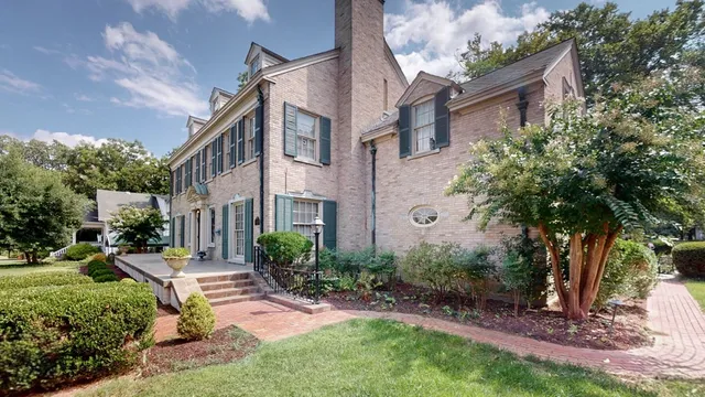 a house view with a sitting space and garden