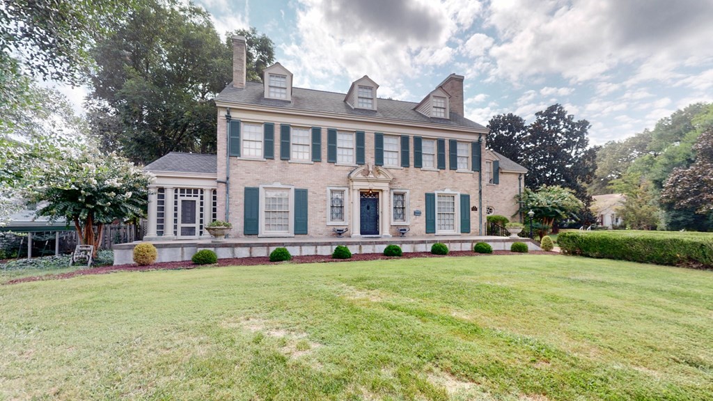 505 Walnut Street Paris, TN 38242 - Photo 47 of 54 a view of a house with a yard and sitting area