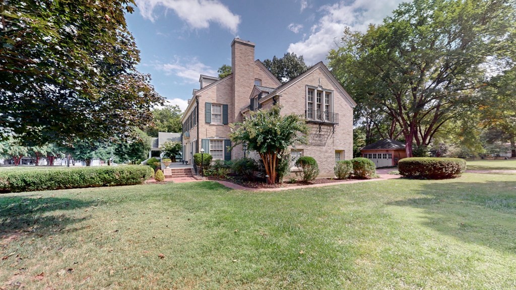 505 Walnut Street Paris, TN 38242 - Photo 50 of 54 a house view with a sitting space and garden