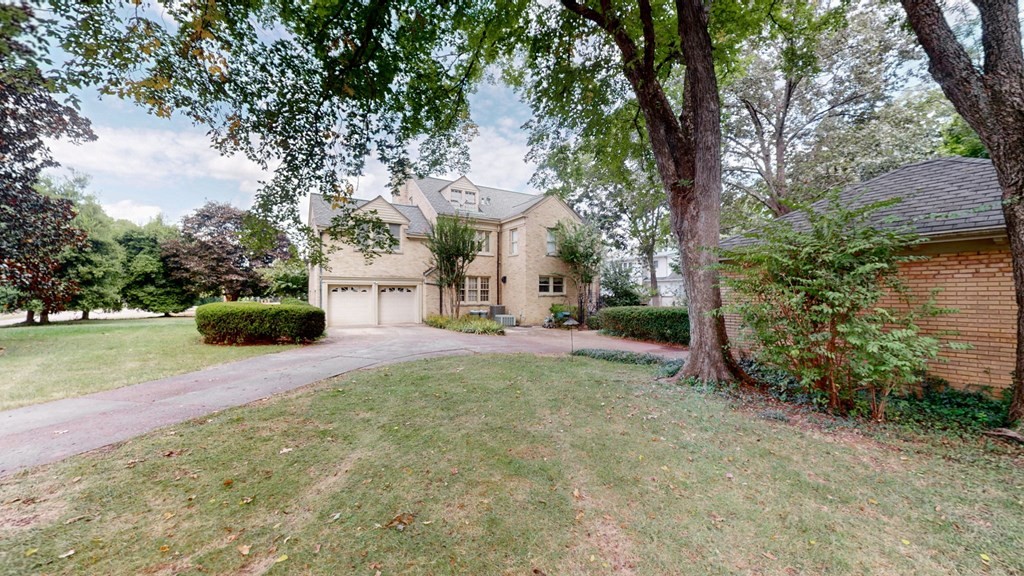 505 Walnut Street Paris, TN 38242 - Photo 53 of 54 a front view of a house with a yard and garage