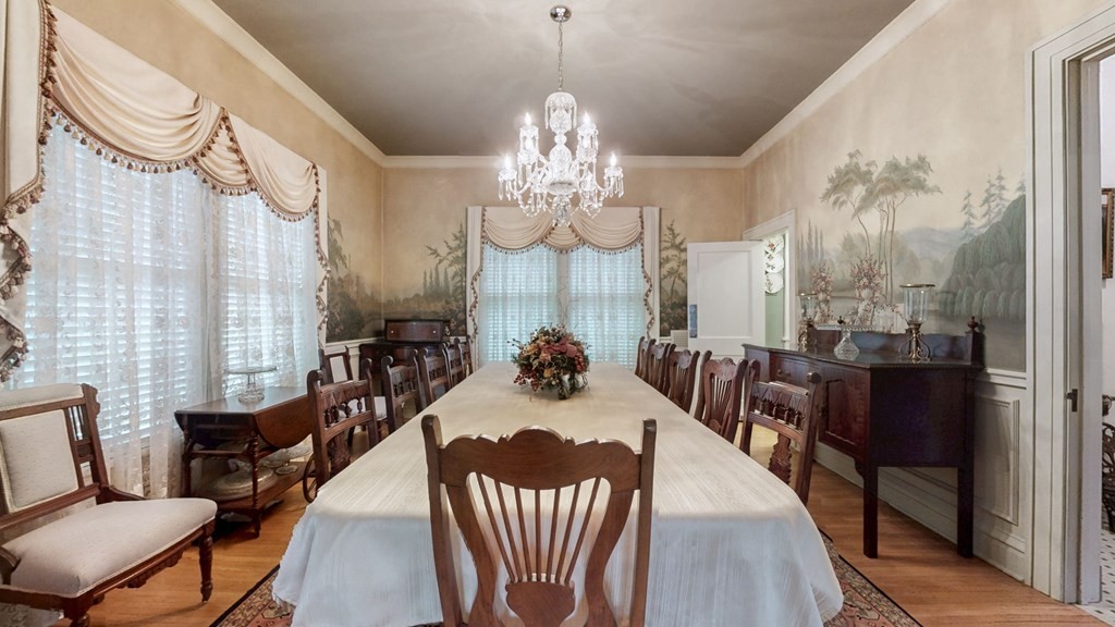 505 Walnut Street Paris, TN 38242 - Photo 6 of 54 a view of a dining room with furniture and a chandelier